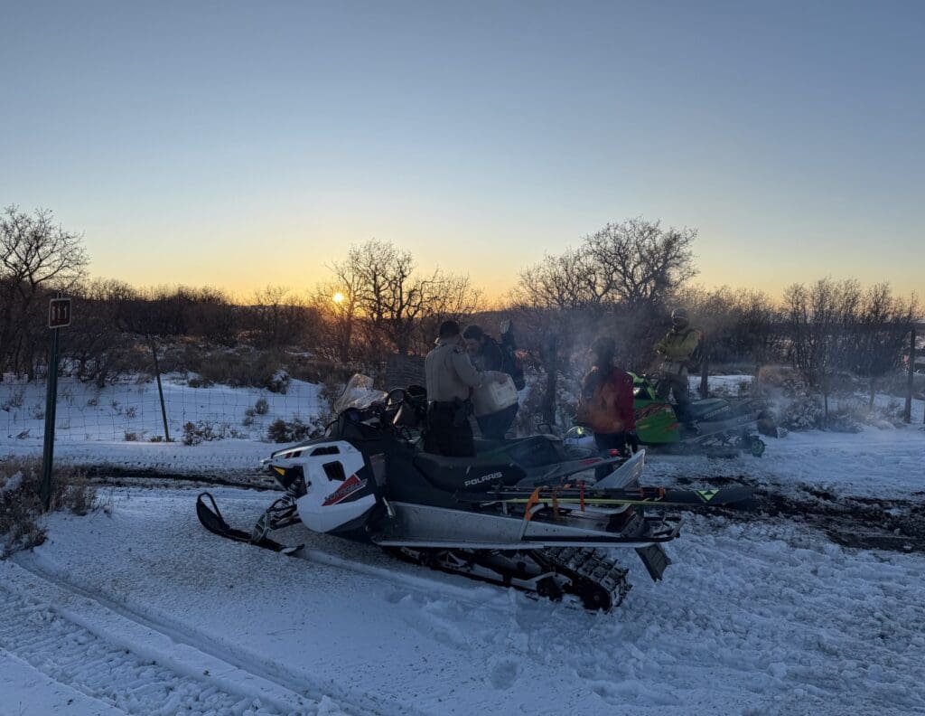 SAR rescues two stuck snowmobilers.